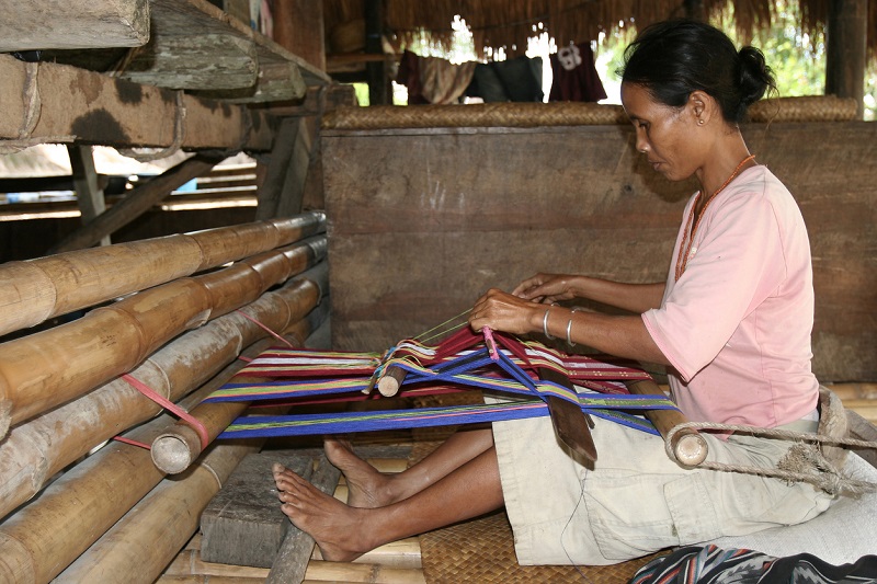 Indonesian woman working on loom